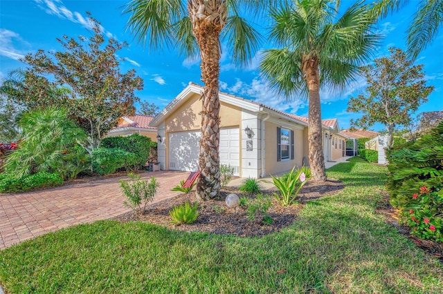 view of front of house featuring a garage and a front yard