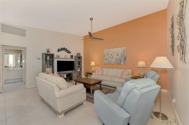 living room with ceiling fan and light tile patterned floors