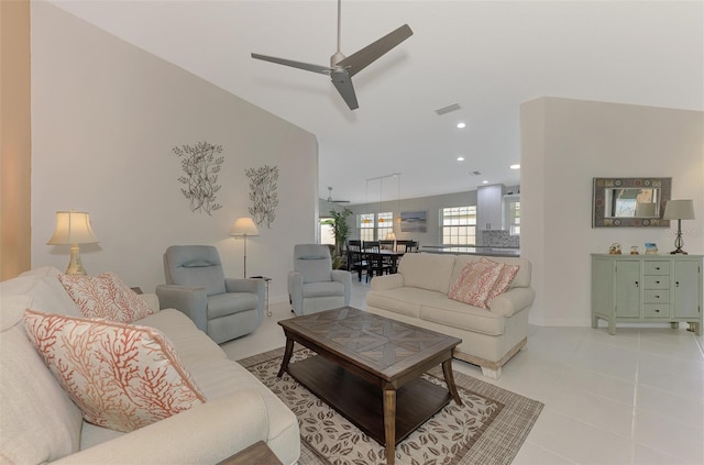 living room featuring ceiling fan and light tile patterned flooring