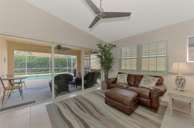 living room featuring lofted ceiling and light tile patterned floors