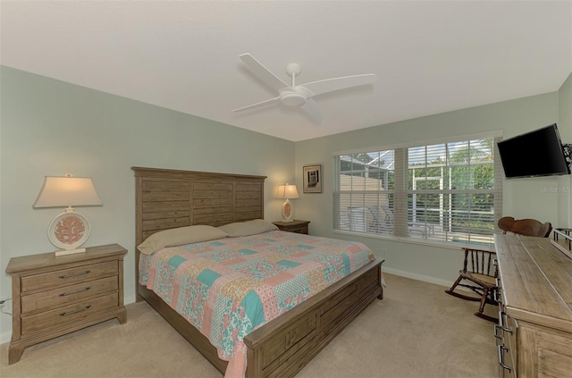 bedroom featuring ceiling fan and light colored carpet