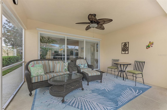 sunroom featuring ceiling fan