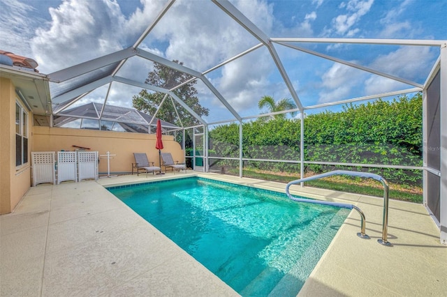 view of swimming pool with a lanai and a patio area