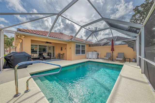 view of pool featuring outdoor lounge area, area for grilling, a patio, and glass enclosure