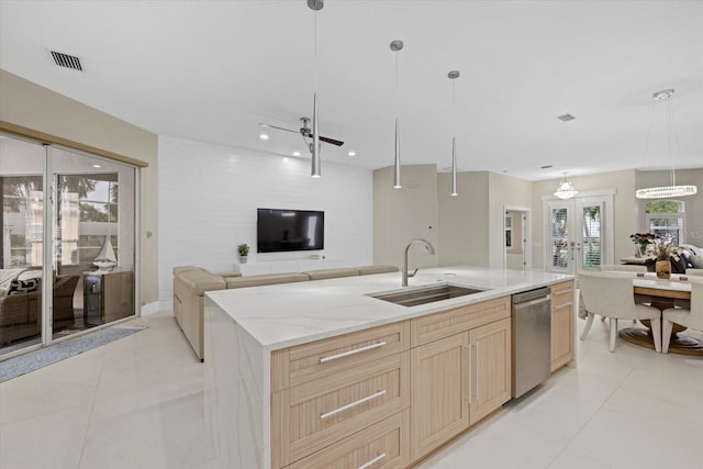 kitchen with ceiling fan, sink, pendant lighting, light brown cabinets, and dishwasher