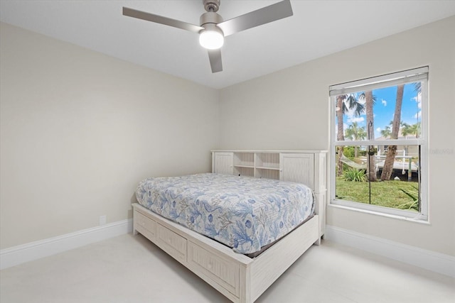 bedroom featuring multiple windows and ceiling fan