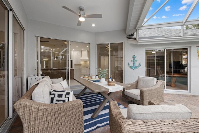 view of patio / terrace with ceiling fan and a lanai