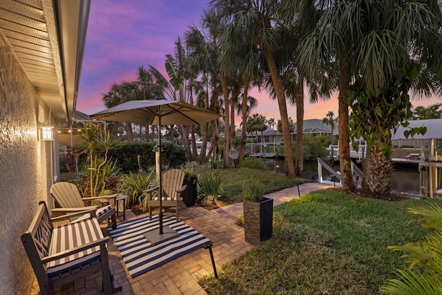 exterior space featuring a patio and a water view