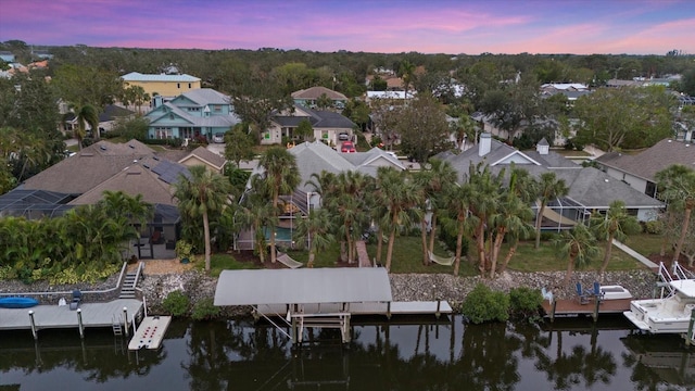 aerial view at dusk with a water view