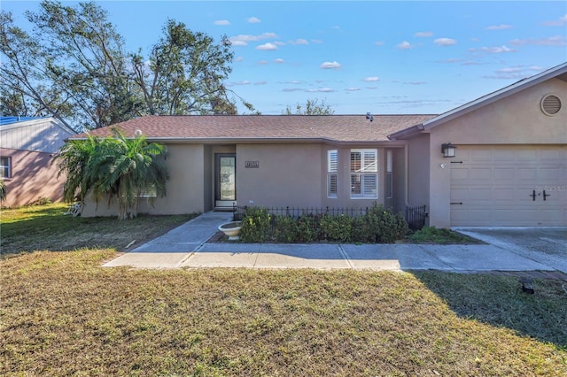 single story home with a front lawn and a garage