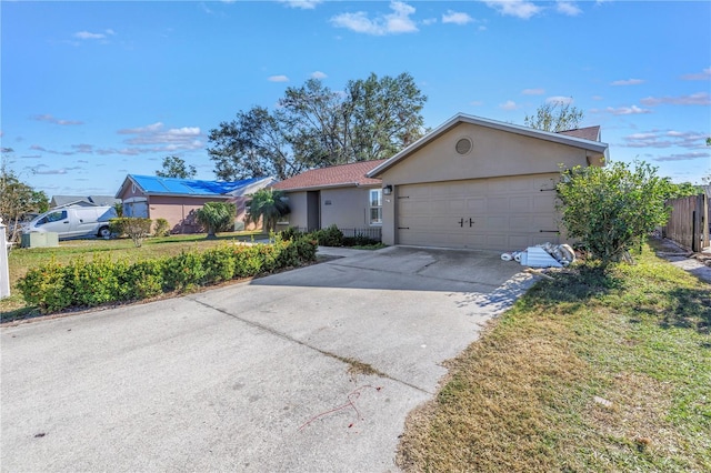 single story home featuring a garage