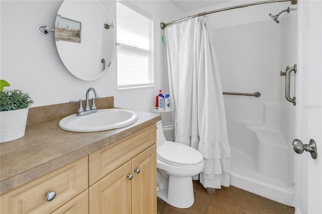 bathroom with tile patterned flooring, vanity, toilet, and a shower with shower curtain