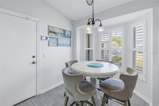 dining area with vaulted ceiling