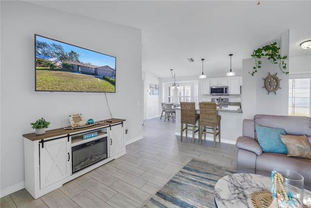 living room with lofted ceiling