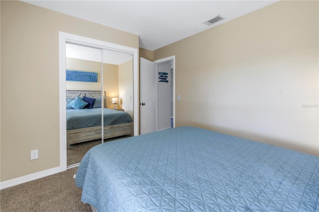 carpeted bedroom featuring a closet