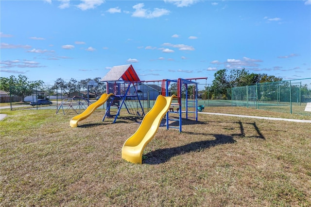 view of jungle gym featuring a lawn