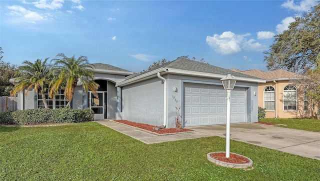 ranch-style home with a garage and a front yard