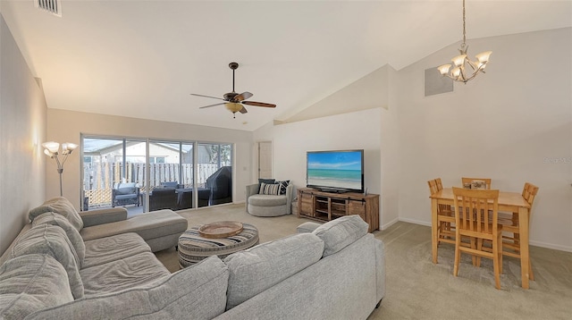 carpeted living room with ceiling fan with notable chandelier and high vaulted ceiling