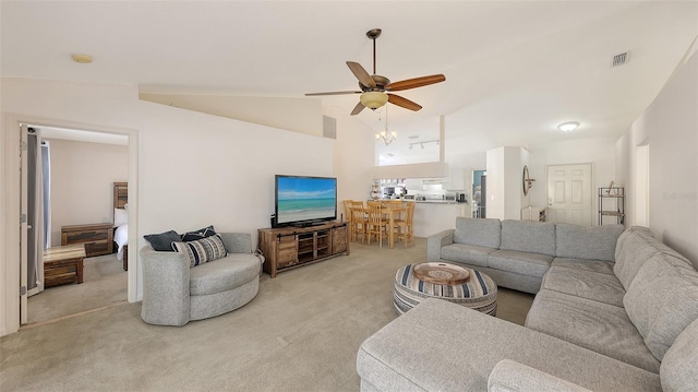 living room featuring light carpet, high vaulted ceiling, and ceiling fan