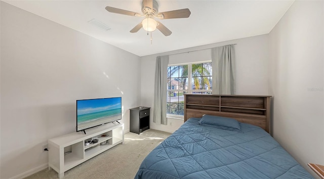 carpeted bedroom featuring ceiling fan