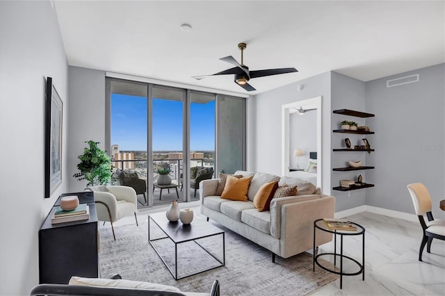 living room featuring floor to ceiling windows and ceiling fan