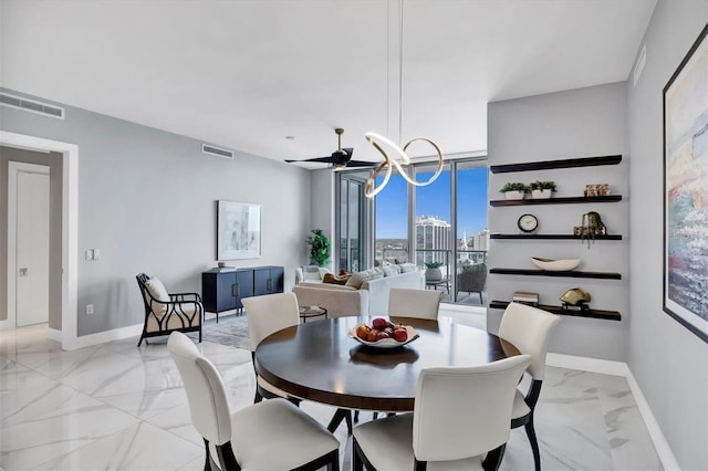 dining area featuring a notable chandelier