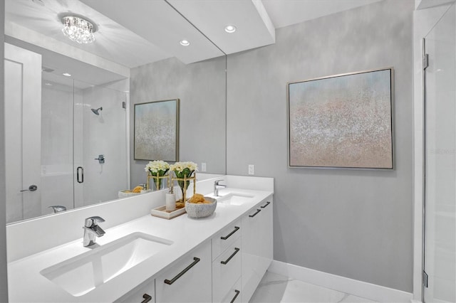 bathroom featuring vanity and a shower with shower door