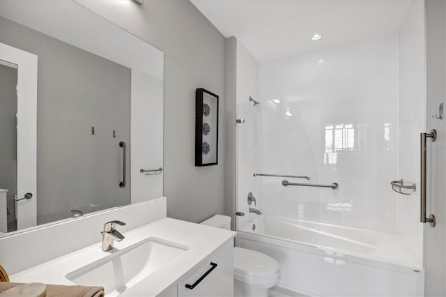 full bathroom featuring toilet, vanity, and tiled shower / bath