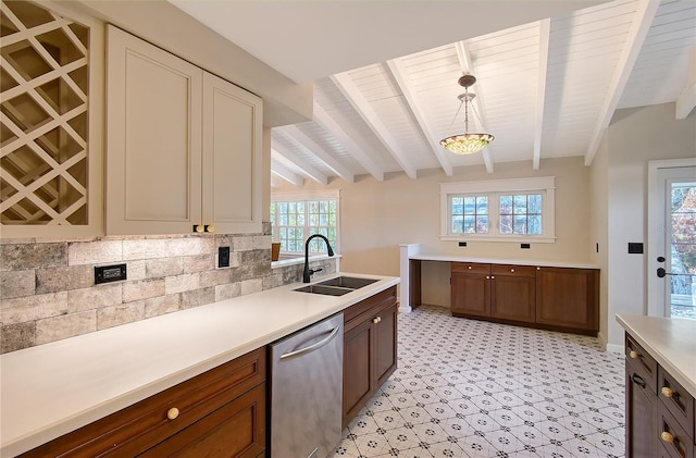 kitchen featuring pendant lighting, sink, beamed ceiling, and dishwasher