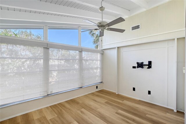 interior space featuring ceiling fan and beam ceiling