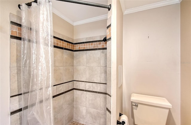 bathroom with ornamental molding, toilet, and a shower with shower curtain