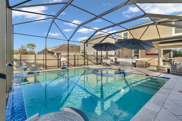 view of swimming pool featuring a lanai, a patio area, and an in ground hot tub