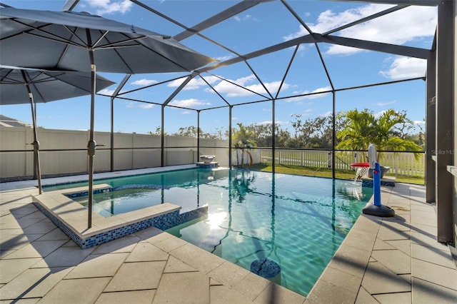 view of pool featuring an in ground hot tub, a patio, and glass enclosure