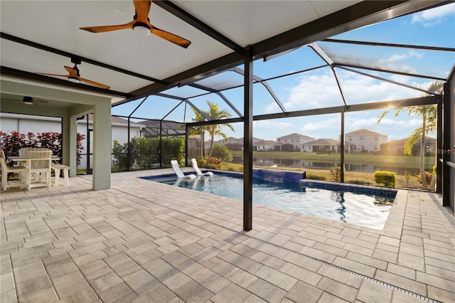 view of pool with a lanai, pool water feature, and a patio