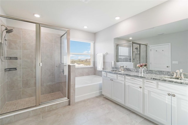 bathroom with tile patterned floors, vanity, and plus walk in shower