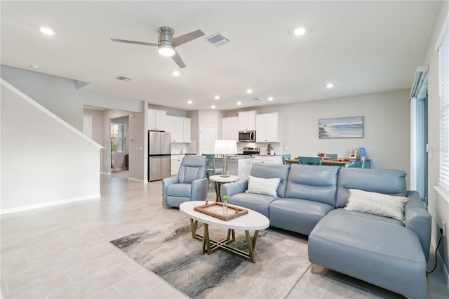 living room featuring ceiling fan