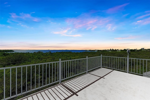 view of balcony at dusk