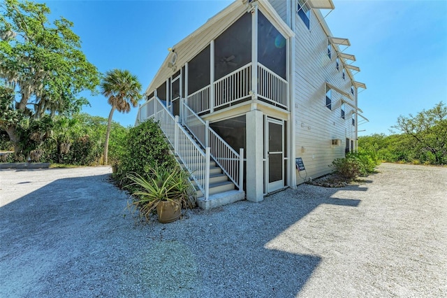 view of home's exterior featuring a sunroom