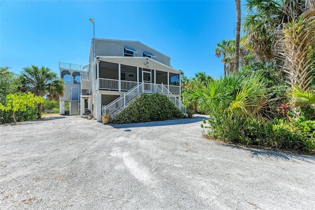 coastal home featuring a porch