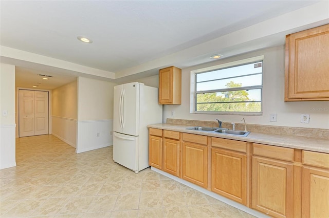 kitchen with white refrigerator and sink