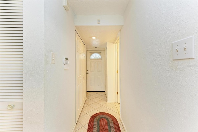 hallway featuring light tile patterned flooring