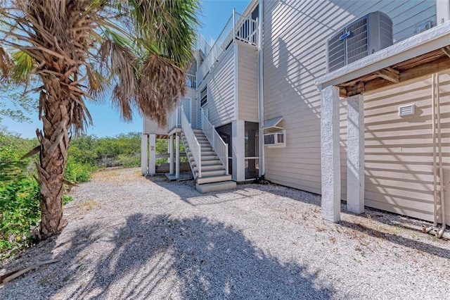 view of side of property featuring central air condition unit