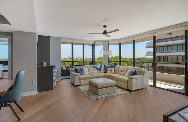 sunroom / solarium with ceiling fan and a wealth of natural light