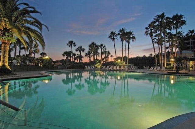 view of pool at dusk