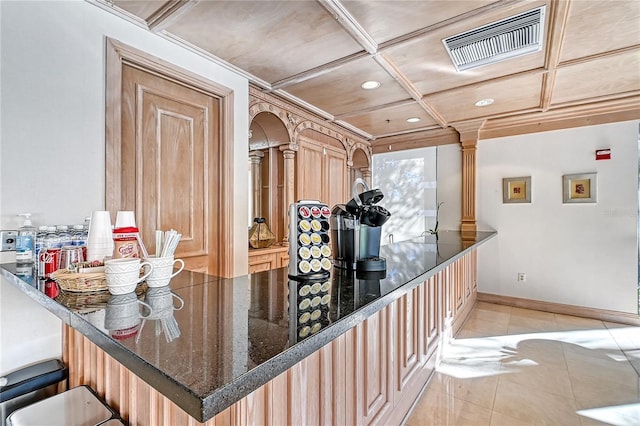 kitchen featuring coffered ceiling, light brown cabinetry, light tile patterned flooring, kitchen peninsula, and decorative columns