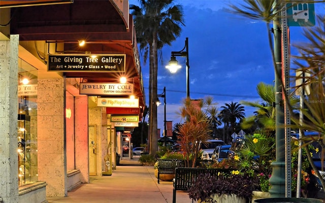 view of outdoor building at dusk