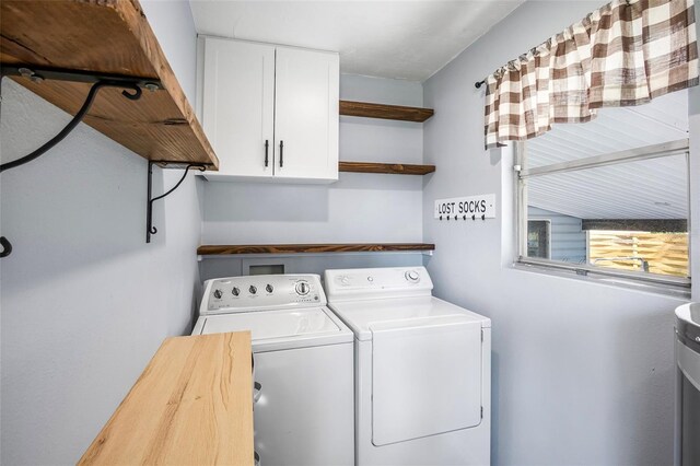 laundry area featuring cabinets and washer and dryer