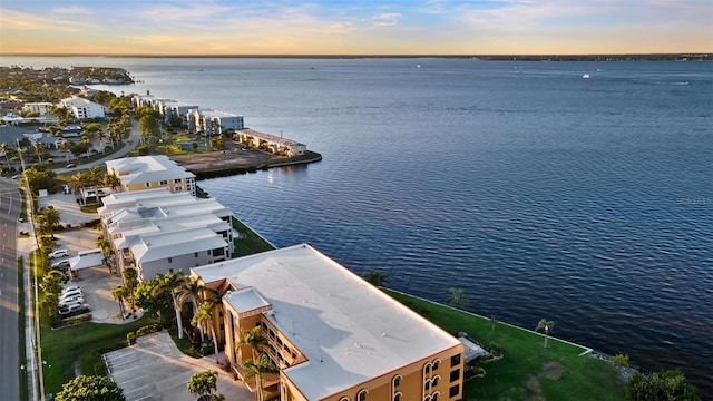 aerial view at dusk with a water view