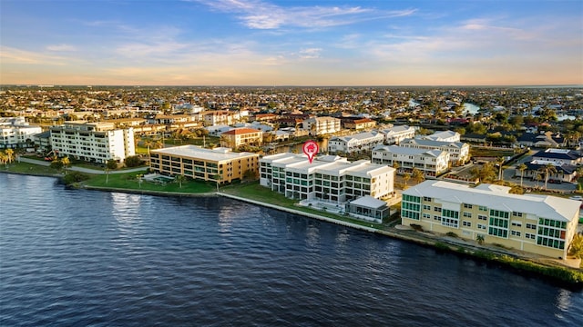 aerial view at dusk with a water view