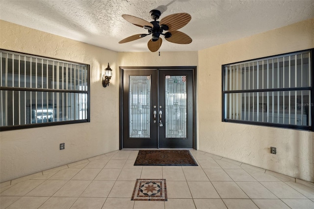 doorway to property with ceiling fan and french doors